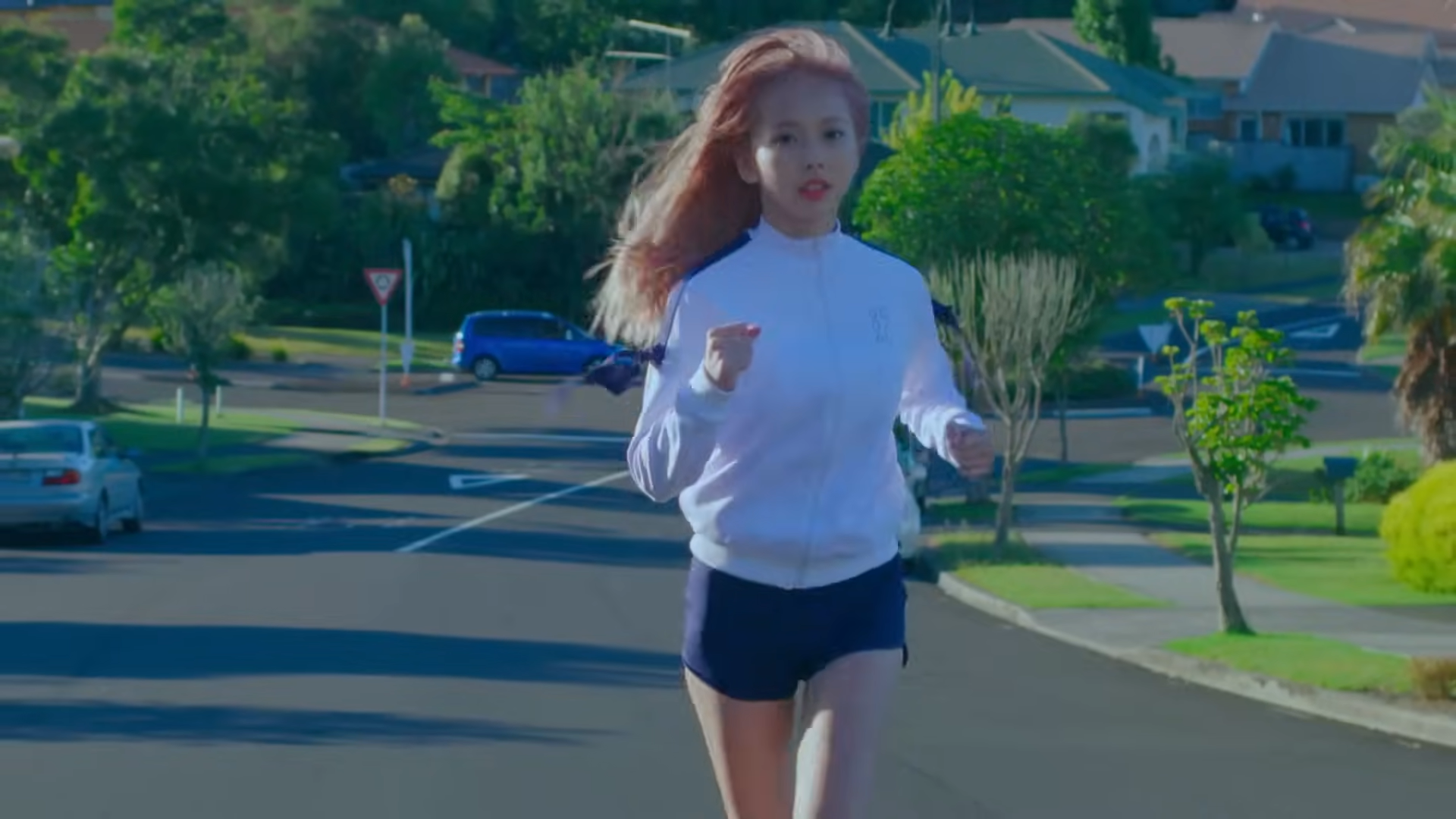 Vivi running through the suburbs.